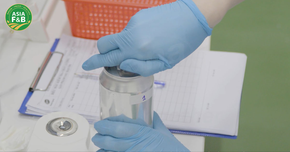 FDA approved beverage manufacturer conducting quality control inspection